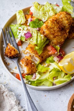 Breaded Chicken Breast topped with a Mediterranean Salad